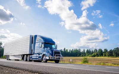 Blue tractor trailer on highway PA PUC number